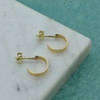 Gold semicircular stud earrings