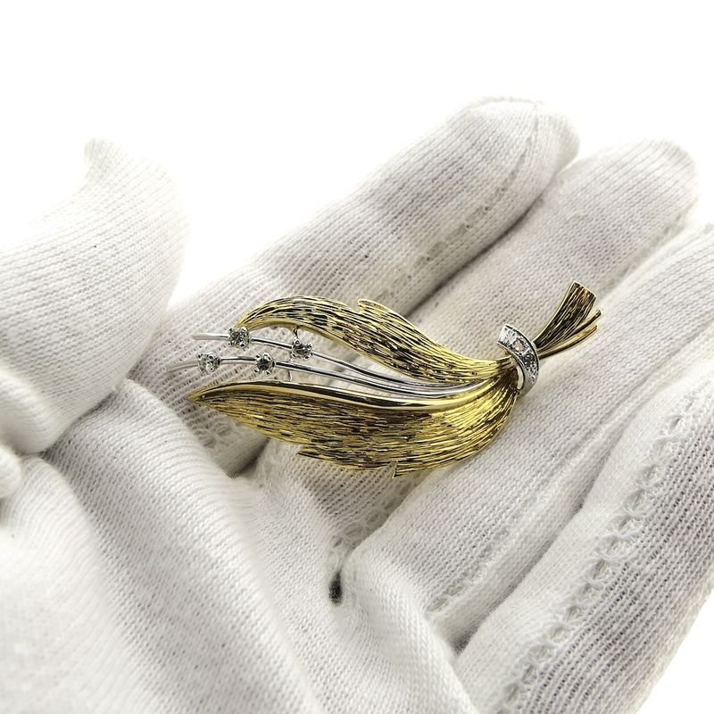 Image 8 of Two-tone gold brooch of a leaf with diamonds; 0.12 ct.