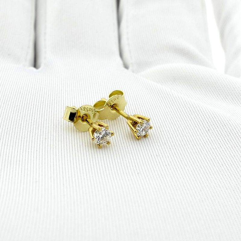 Image 9 of Gold solitaire stud earrings with diamond; 0.32 ct.