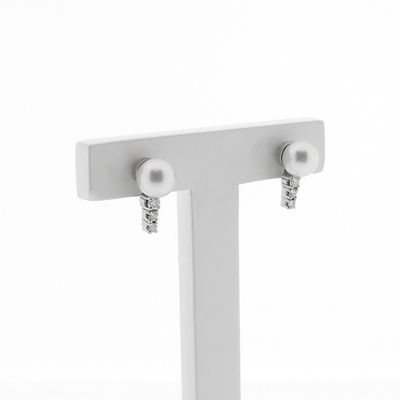 White gold stud earrings set with diamonds and a pearl | 0.17 ct. Image 1 of White gold stud earrings set with diamonds and a pearl | 0.17 ct.