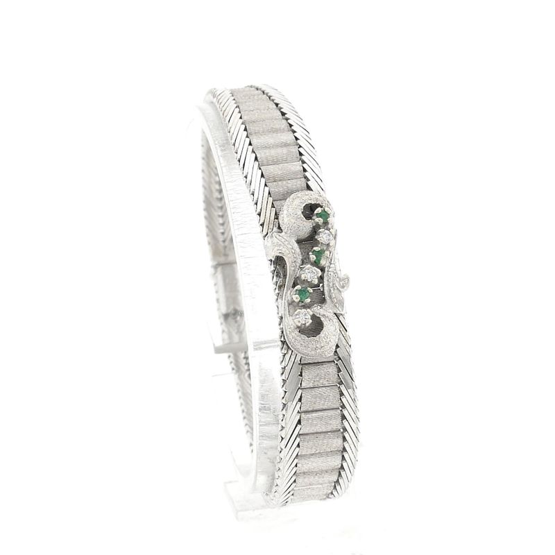 Image 1 of White gold bracelet with emerald and diamonds; 0.045 ct.