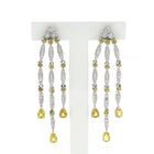 Image 1 of White gold stud earrings with yellow sapphire and diamond; 0.56 ct.