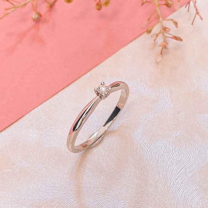 Image 2 of White gold solitaire ring with 0.06 ct diamond.