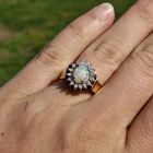 Image 7 of Gold ring with opal and entourage of diamonds; 0.16 ct.