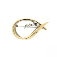 Gold brooch with diamonds; 0.26 ct.