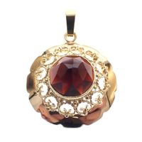 Vintage gold pendant with garnet