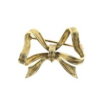 Gold brooch; Bow