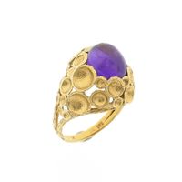 Gold cocktail ring with amethyst