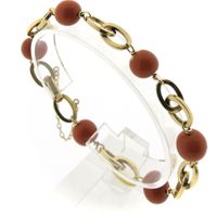 Antique gold bracelet with blood coral beads.