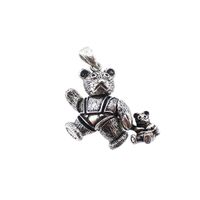 Silver pendant of a bear