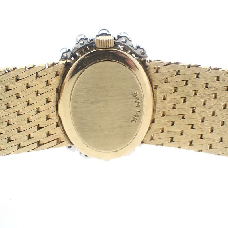 Image 16 of Baume Mercier Vintage; 14k. gouden horloge met briljanten en saffier