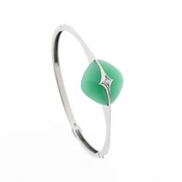 White gold bracelet with jade and diamond 0.035 ct.