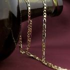 Image 2 of Two-tone gold Figaro link chain