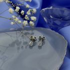 Image 2 of White gold solitaire stud earrings with 0.12 ct diamond.