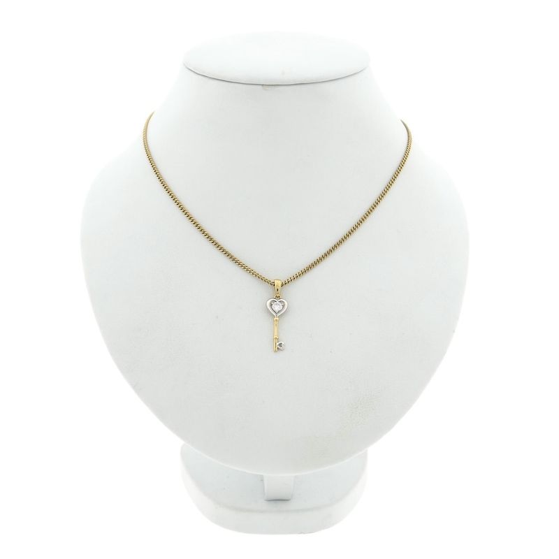 Image 3 of Two-tone gold pendant of a key with zirconia