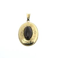 Vintage gold pendant with garnet