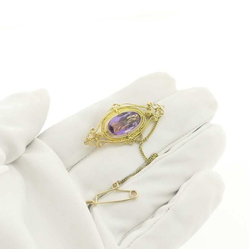 Image 2 of Gold brooch with amethyst.
