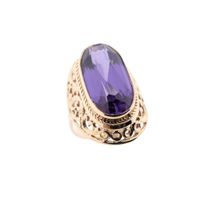Antique gold ring with synthetic purple sapphire.