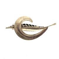 Gold brooch of a feather