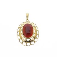 Vintage gold pendant with garnet