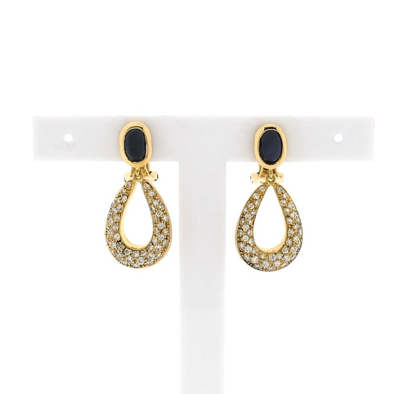 Image 1 of Gold clip-on earrings with sapphires and diamonds; Approx. 1.00 ct.