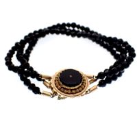 Antique bracelet with onyx and gold decorative clasp