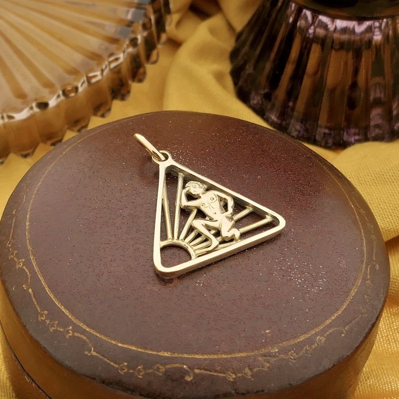 Image 8 of Gold pendant of the naturist symbol