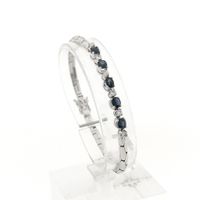 White gold cobra link bracelet with sapphire and diamond; 0.24 ct.