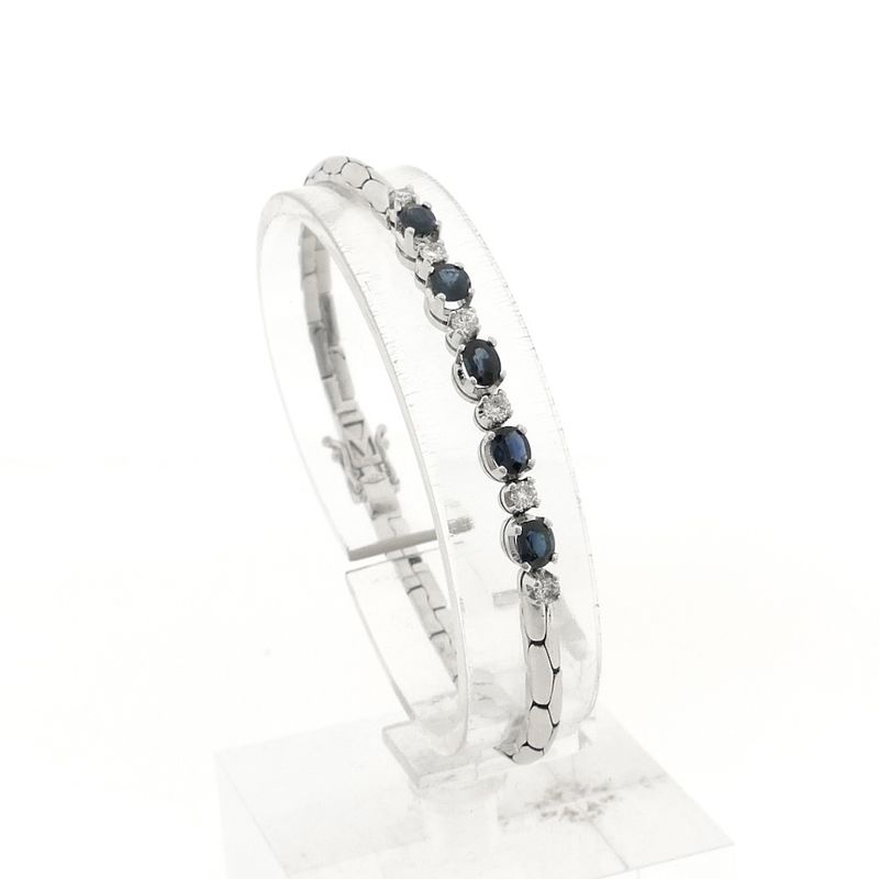 Image 1 of White gold cobra link bracelet with sapphire and diamond; 0.24 ct.