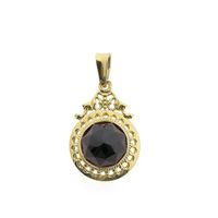 Vintage gold pendant with garnet