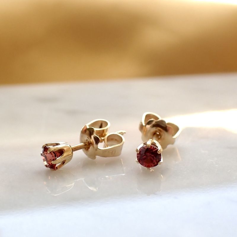 Image 2 of Gold stud earrings with red/rose stone