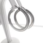 Image 4 of Silver flat hoop earrings with ribbed edge | Ø 33 mm