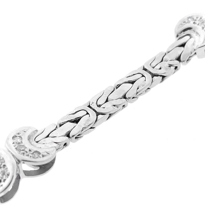 Image 8 of White gold flat king bracelet with fixed charms and 0.24 ct diamond.
