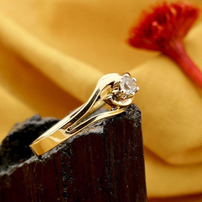 Image 2 of Golden solitaire ring with diamond; 0.09 ct.