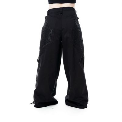 Foto van Vixxsin | Goth punk skaterbroek Mariposa, zwart met corsetdetails en kanten vleugels op de achter