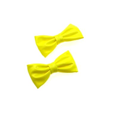 Zacharia | Paar PVC neon gele strikjes op haarclip 