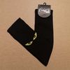 Afbeelding van Flirt | Overknee sokken zwart met gele kattenogen